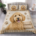 Labradoodle quilt bedding styled in a bright bedroom with a large dog portrait and paw print accents