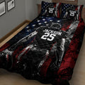 Close view of a football player quilt blanket with stars and red, black, and blue sports graphics