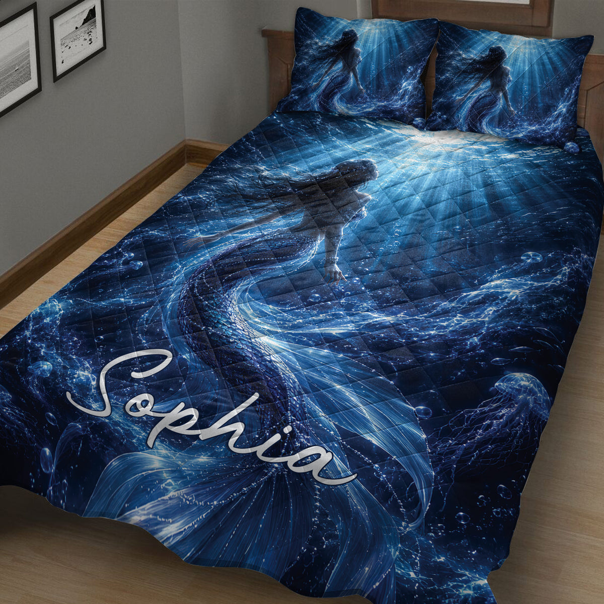 Mermaid quilt blanket spread across a bedroom with blue ocean scenery, flowing water, bubbles, and jellyfish