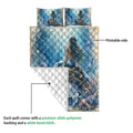 Mermaid quilt showing the printed ocean side and white diamond-stitched backing