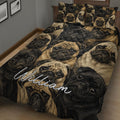 Close bedroom view of a pug quilt blanket featuring expressive black and fawn dog faces