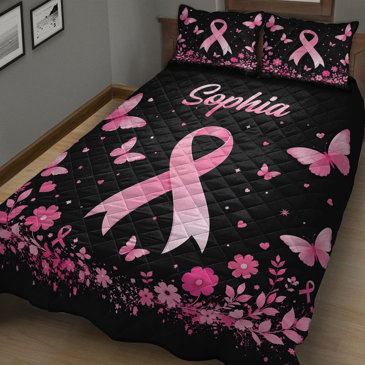 Close bedroom view of a black breast cancer quilt with large pink ribbon, butterflies, and flowers