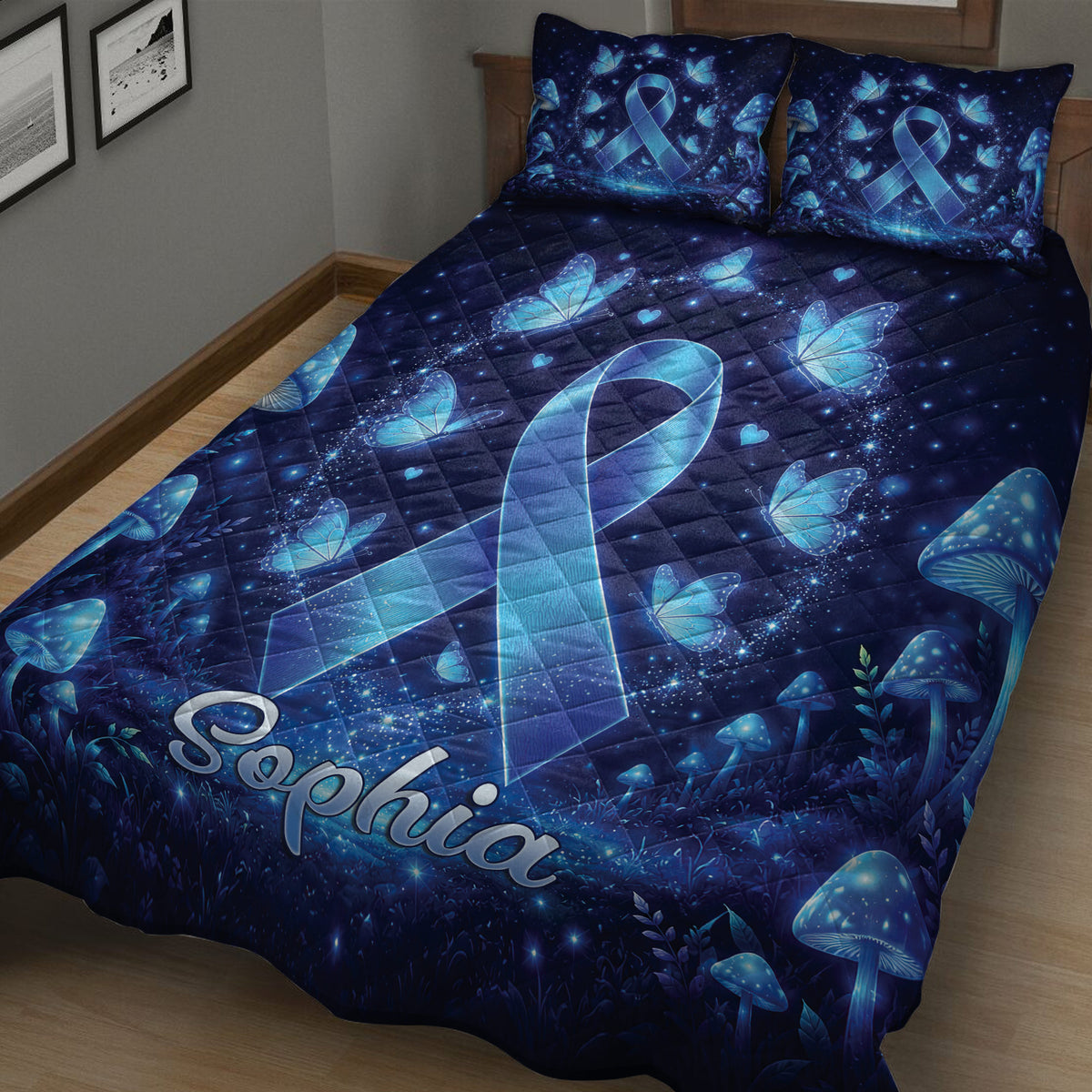 Close bedroom view of a diabetes awareness quilt with a large blue ribbon, butterflies, stars, and mushrooms