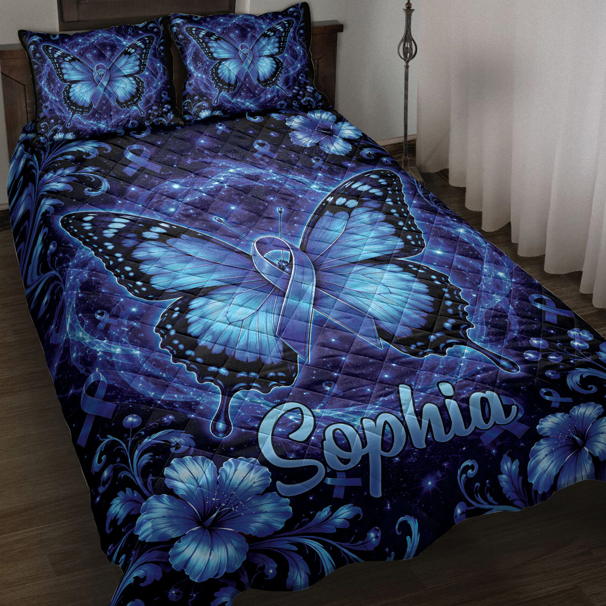 Blue butterfly diabetes awareness quilt blanket displayed on a bed with floral details and awareness ribbons