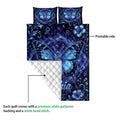 Blue butterfly diabetes awareness quilt showing the printed front and white quilted backing