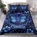 Diabetes awareness butterfly quilt blanket styled on a bedroom bed with blue floral artwork