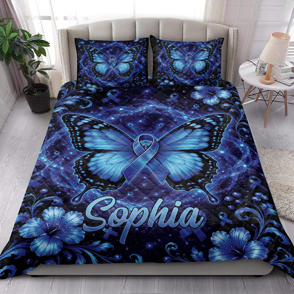 Diabetes awareness butterfly quilt blanket styled on a bedroom bed with blue floral artwork