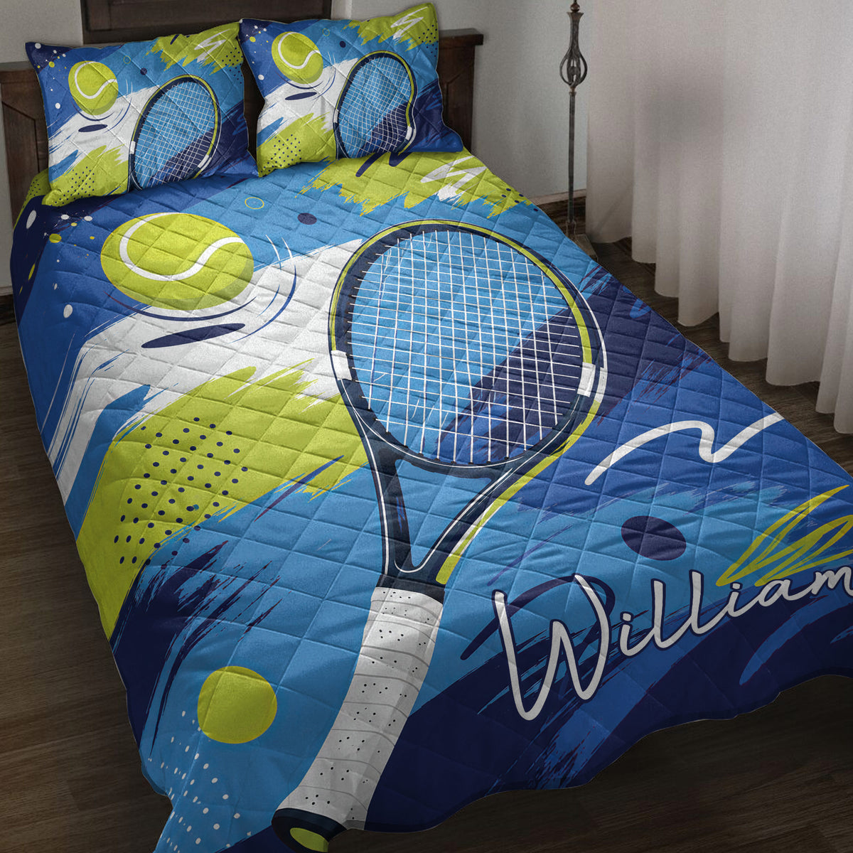 Tennis quilt blanket displayed on a bed with blue and lime artwork, rackets, and tennis balls