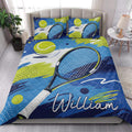 Tennis quilt bedding styled in a bright bedroom with racket and tennis ball artwork