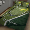Close bedroom view of green tennis quilt bedding with rackets, balls, and court lines