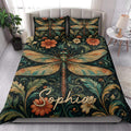 Dragonfly floral quilt blanket styled across a bright bedroom with matching decorative pillows