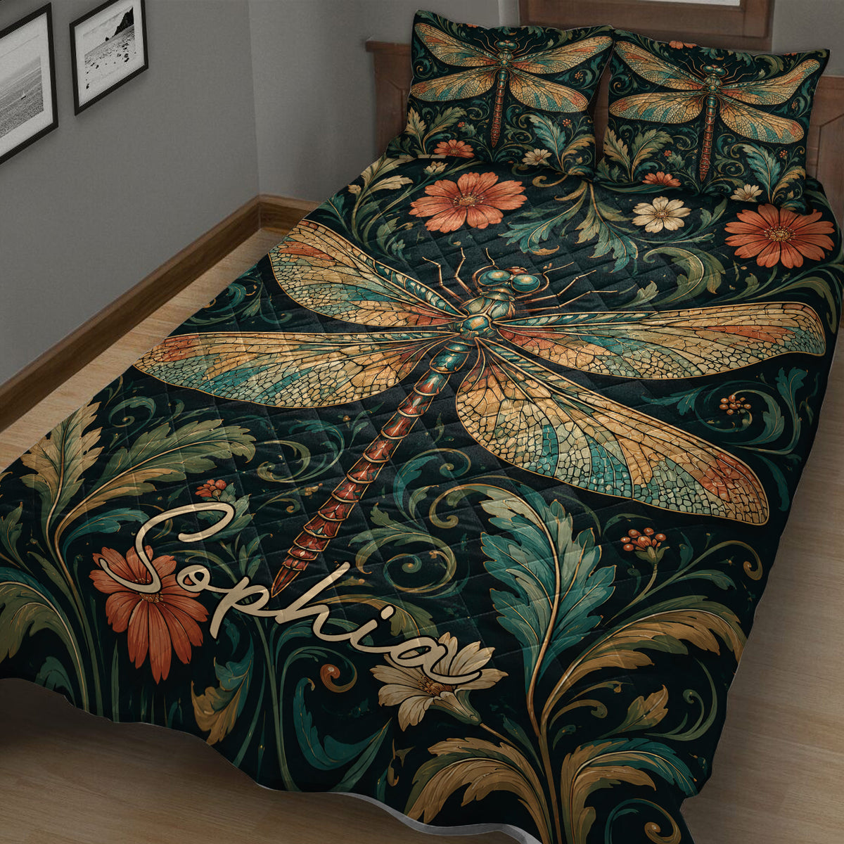 Close-up bedroom view of an ornate dragonfly quilt with teal foliage, flowers, and stained-glass inspired wings
