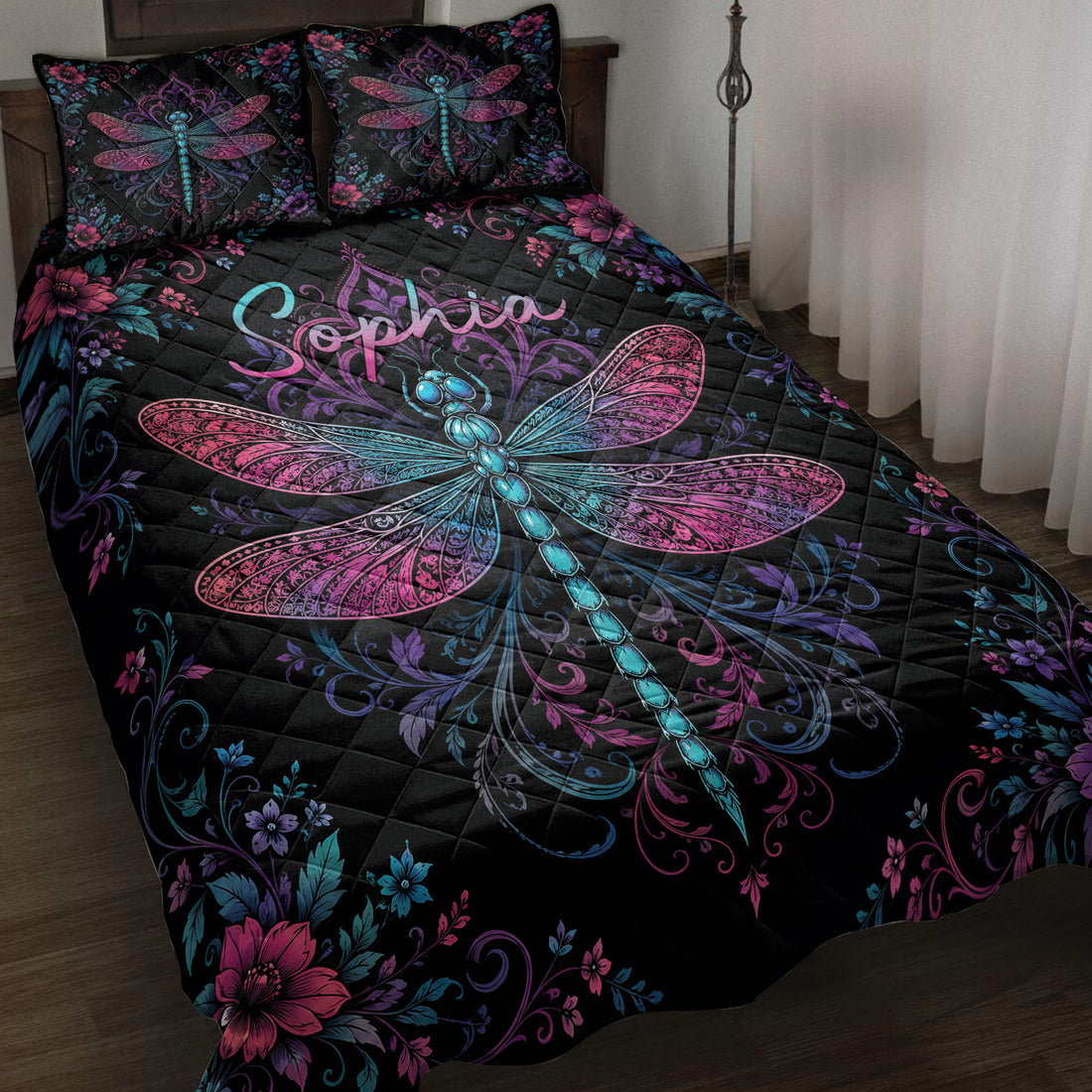 Black dragonfly quilt blanket with vivid pink, purple, and blue floral artwork on a bedroom