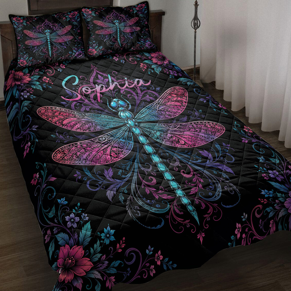 Black dragonfly quilt blanket with vivid pink, purple, and blue floral artwork on a bedroom