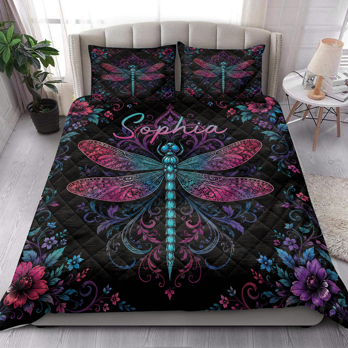 Dragonfly quilt bedding styled on a modern bed with vibrant botanical borders