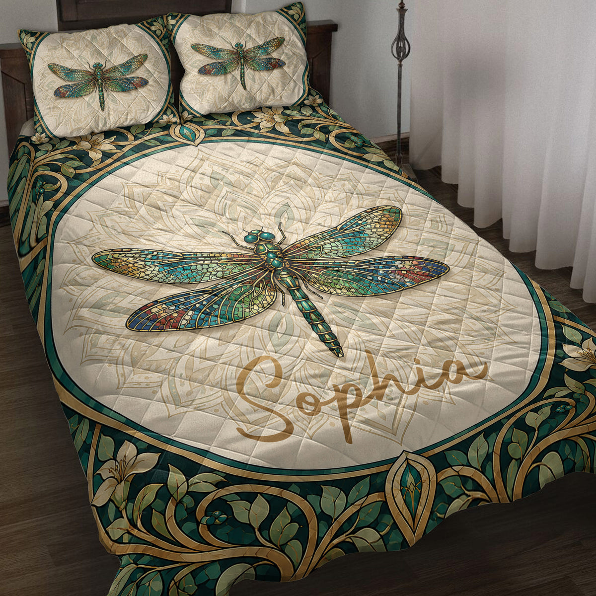 Dragonfly quilt blanket displayed on a bed with ornate teal, cream, gold, and floral artwork