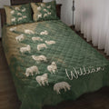 Sheep quilt blanket displayed on a bed with green and tan countryside-inspired artwork