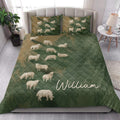 Sheep quilt bedding styled in a bright bedroom with green and tan farm-inspired artwork