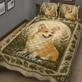 Corgi quilt blanket spread across a bed with vintage woodland foliage and floral artwork