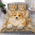Corgi quilt blanket styled on a modern bed in a bright bedroom