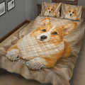 Close lifestyle view of a corgi quilt blanket with matching corgi pillow artwork
