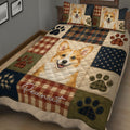 Close view of Corgi quilt bedding with a smiling Corgi portrait, plaid blocks, and colorful paw prints