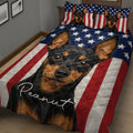 Close bedroom view of a Miniature Pinscher quilt blanket with stars, stripes and bold dog artwork