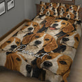 Close bedroom view of a Beagle quilt blanket with repeated joyful dog portraits in warm neutral colors