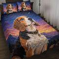 Beagle quilt blanket displayed on a bed with matching dog artwork, mountains, sunset colors, and starry sky