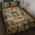 Beagle quilt blanket displayed on a bed with crowned dog portraits, puppies, sunflowers, and rustic collage panels