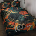 DJ quilt blanket displayed on a bed with turntables, vinyl records, mixer controls, and bold teal and orange artwork