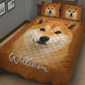 Close bedroom view of a Shiba Inu quilt blanket with a large expressive dog portrait