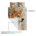 Shiba Inu quilt blanket detail showing the printed front and white diamond-stitched backing