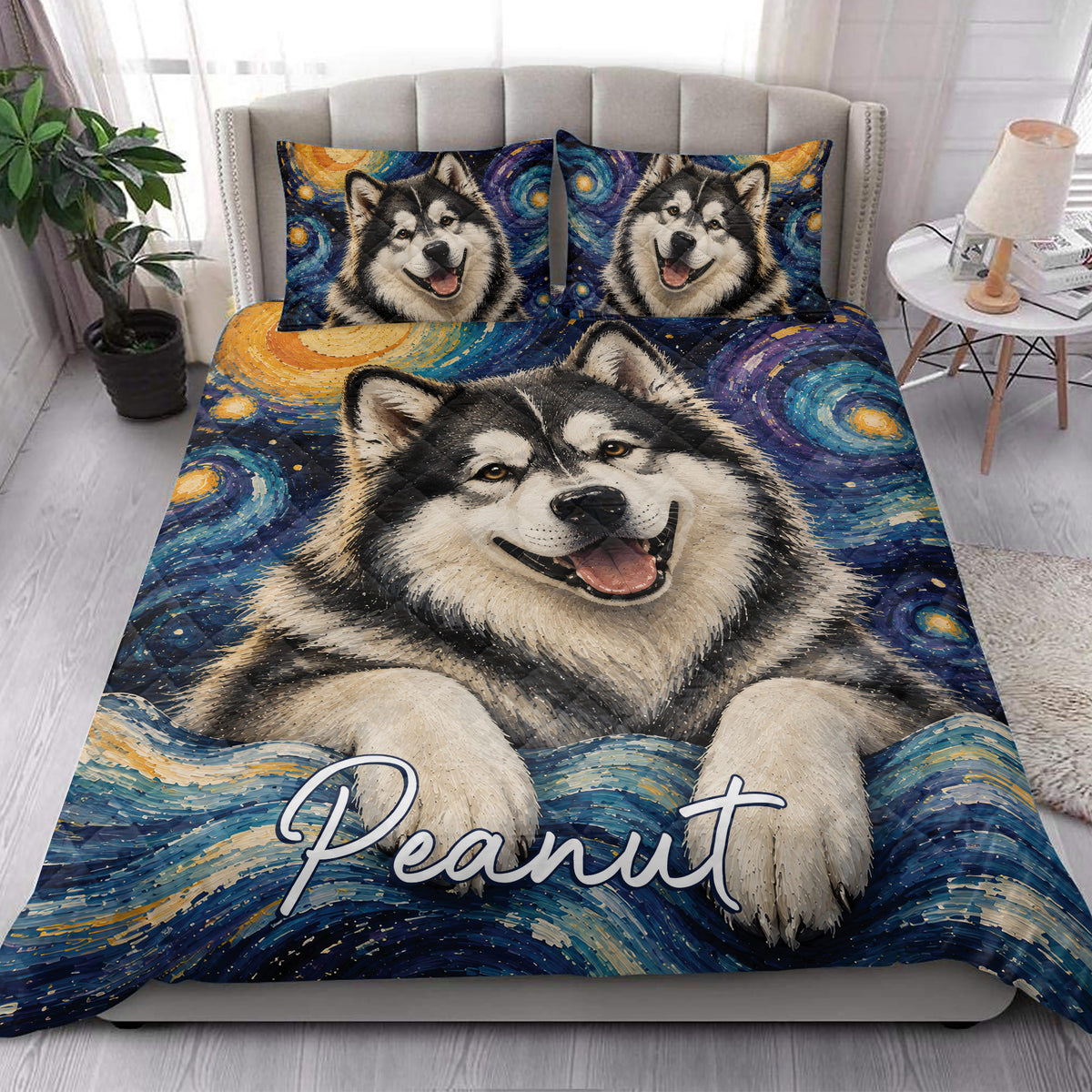 Alaskan Malamute quilt blanket styled in a bright bedroom with a large dog portrait and matching pillows