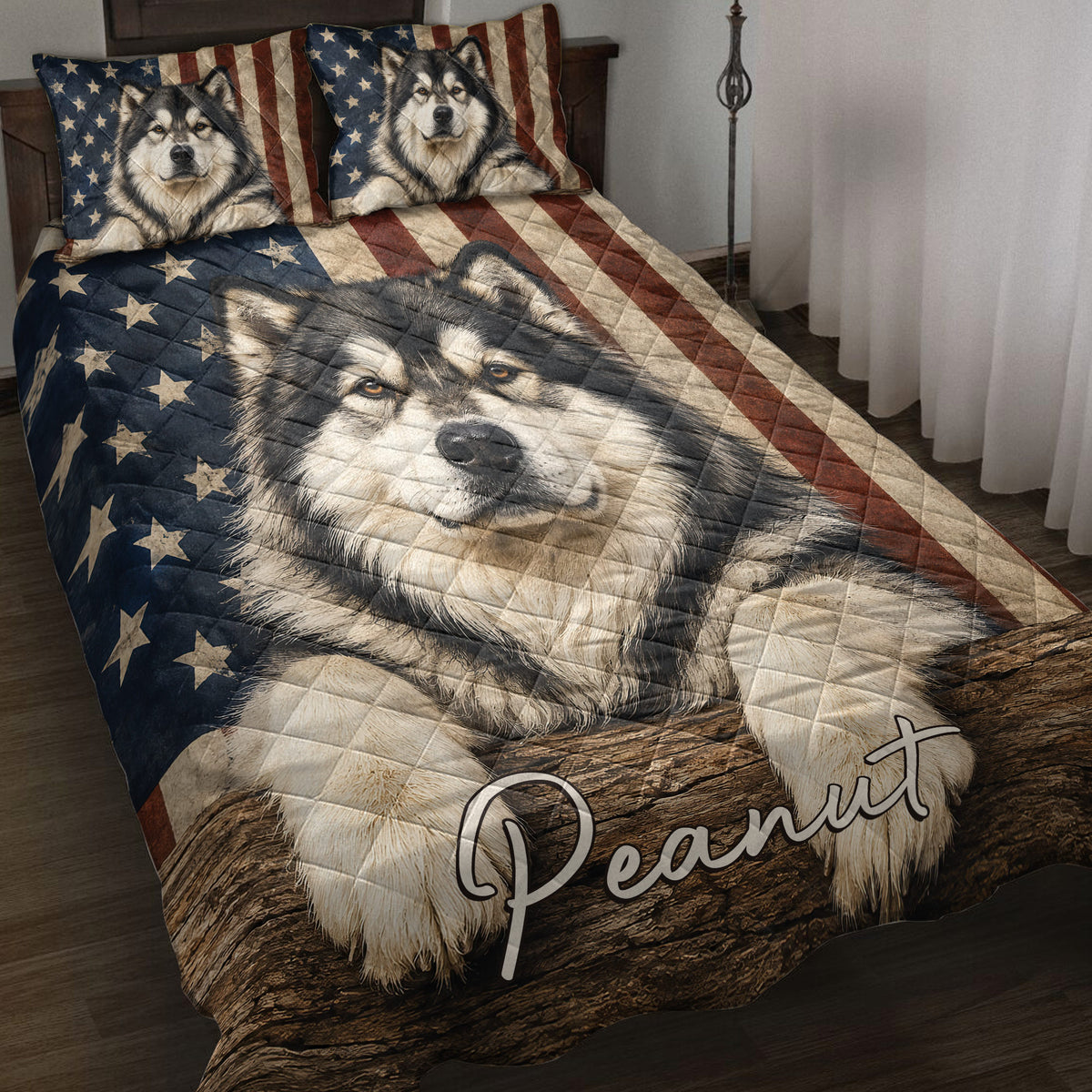 Alaskan Malamute quilt blanket displayed on a bed with patriotic stars and stripes artwork