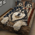 Alaskan Malamute quilt blanket styled across a bed with rustic wood and American flag artwork