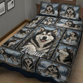 Close bedroom view of an Alaskan Malamute quilt with snowy forest portrait panels