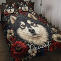Alaskan Malamute quilt blanket displayed on a bed with floral artwork and coordinated dog portrait pillows