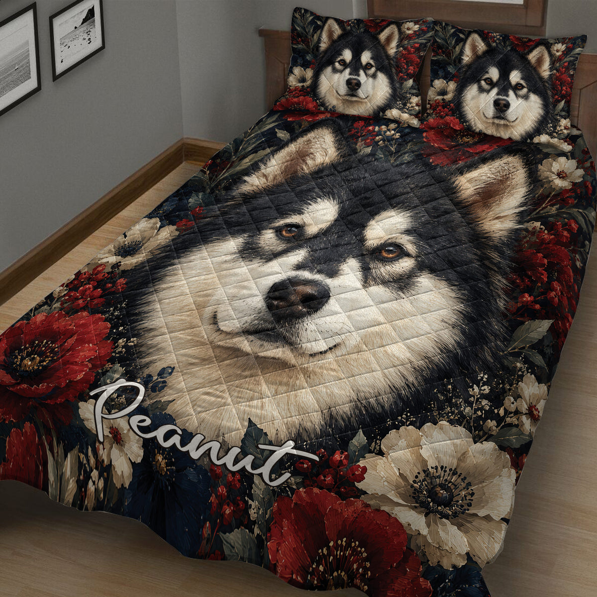 Angled bedroom view of an Alaskan Malamute quilt blanket with close-up dog artwork and red floral accents