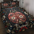 Ladybug quilt blanket spread across a bed with ornate floral artwork in black, red, blue, and cream