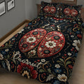 Close bedroom view of a ladybug quilt blanket with detailed flowers, leaves, and decorative botanical patterns