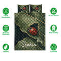 Ladybug quilt bedding set shown front-facing with leafy artwork and green feature icons