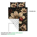 Ladybug quilt blanket detail showing the printed floral front and white quilted reverse