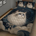 Close bedroom view of a Ragdoll cat quilt blanket with blue eyes, stars, leaves, and woodland-inspired details