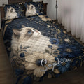 Ragdoll cat quilt blanket displayed on a bed with blue flowers, stars, and dark navy botanical artwork