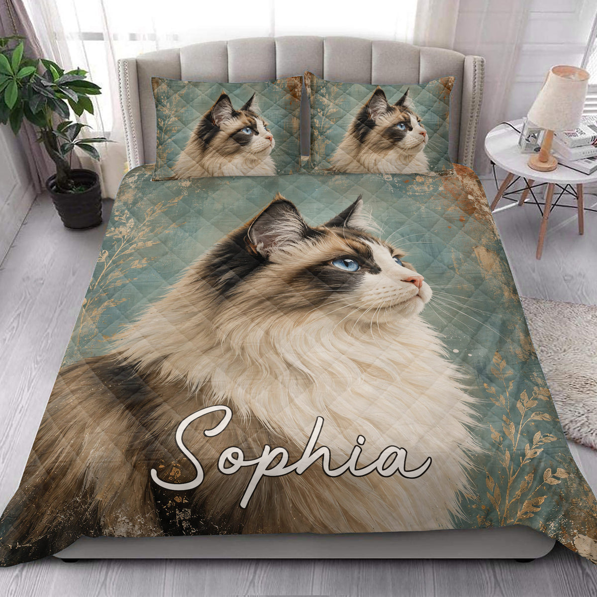Ragdoll cat quilt blanket displayed in a bright bedroom with coordinated cat pillow artwork