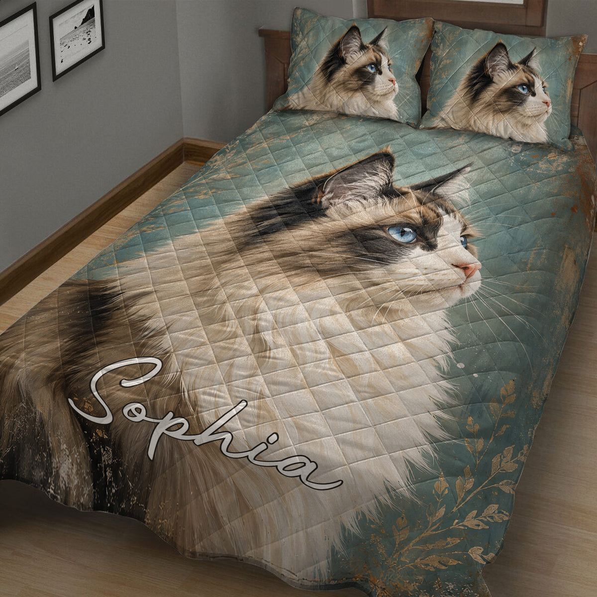 Close bedroom view of a Ragdoll cat quilt blanket with blue eyes, teal tones, and botanical accents