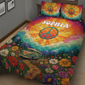 Close view of colorful hippie quilt blanket with peace symbols, wildflowers, mountains, and retro van