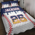 Baseball quilt blanket displayed on a bed with red stitching graphics, colorful accents, and bold sports artwork