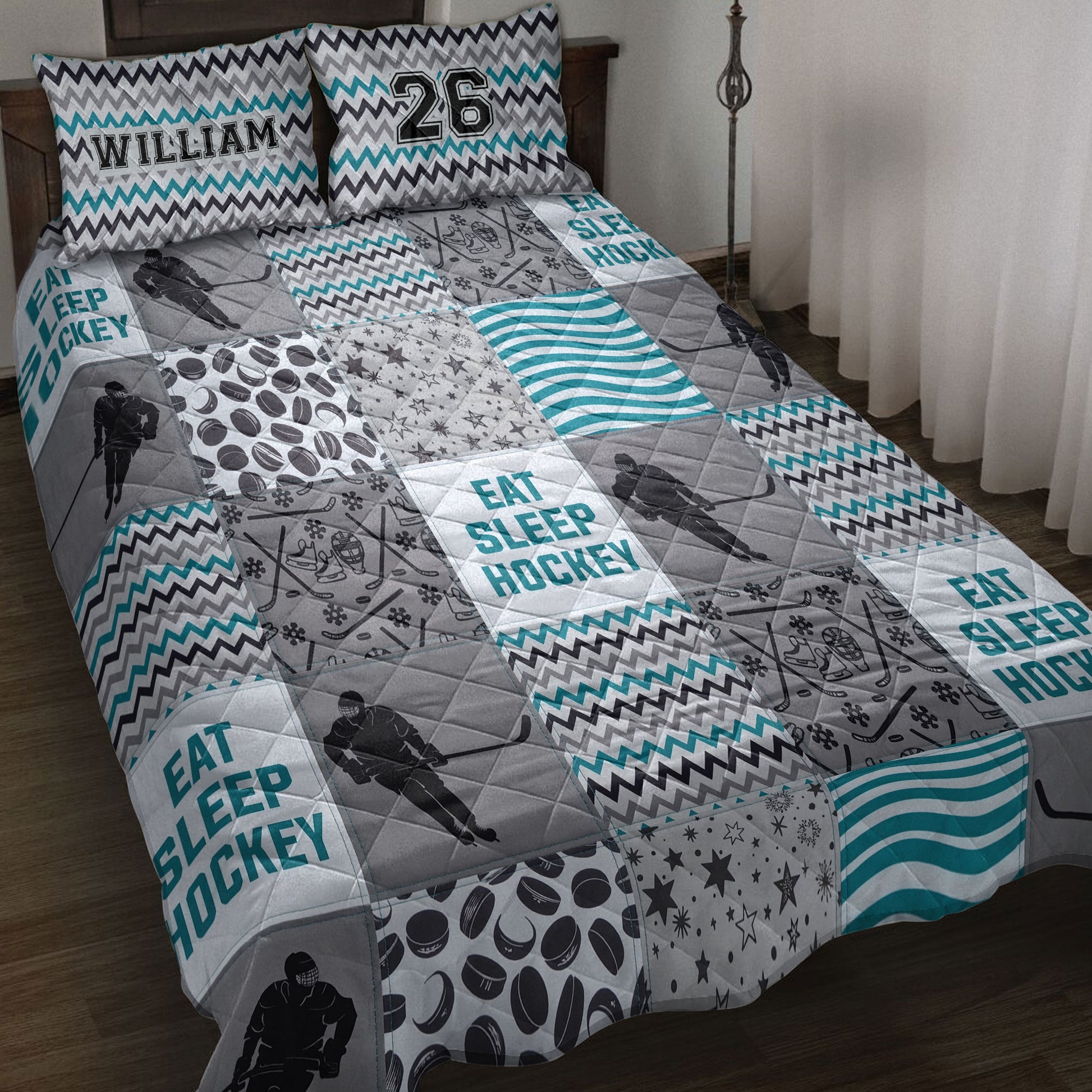 Hockey quilt blanket bedding set displayed on a bed with player silhouettes, pucks, sticks, and teal accents